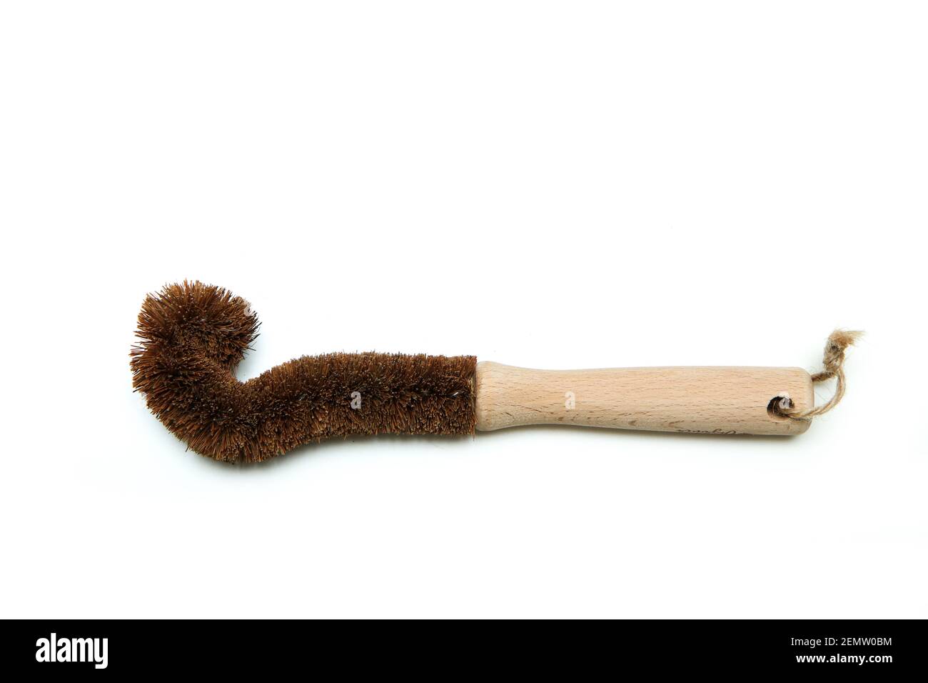 A cleaning brush for bottles made from natural materials. Made from wood and natural bristles. Isolated on a white background. Stock Photo