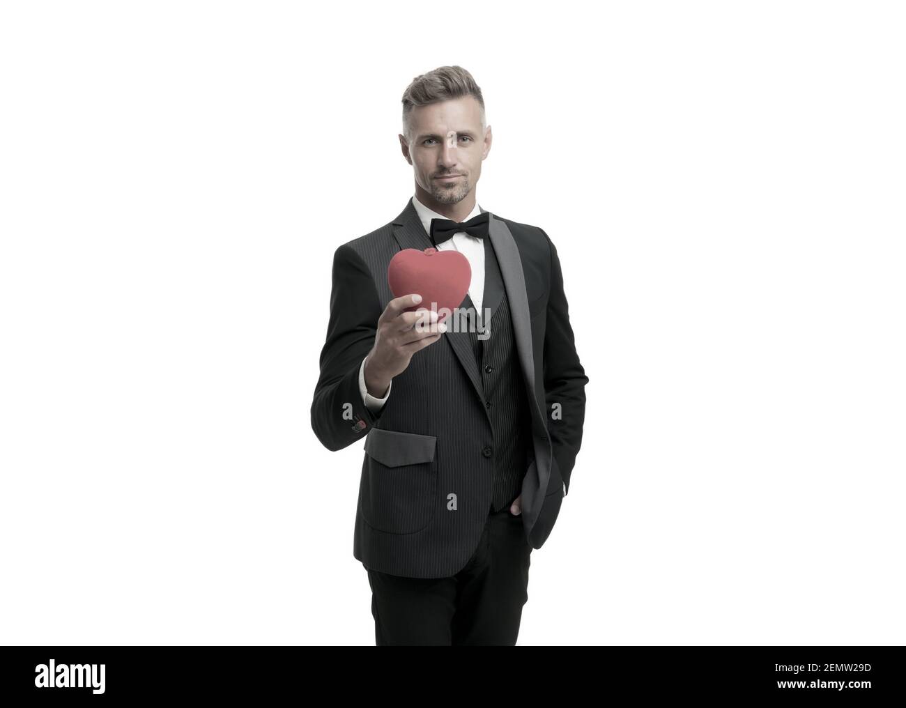 Generous man. Man mature handsome guy wear elegant suit hold red heart ...