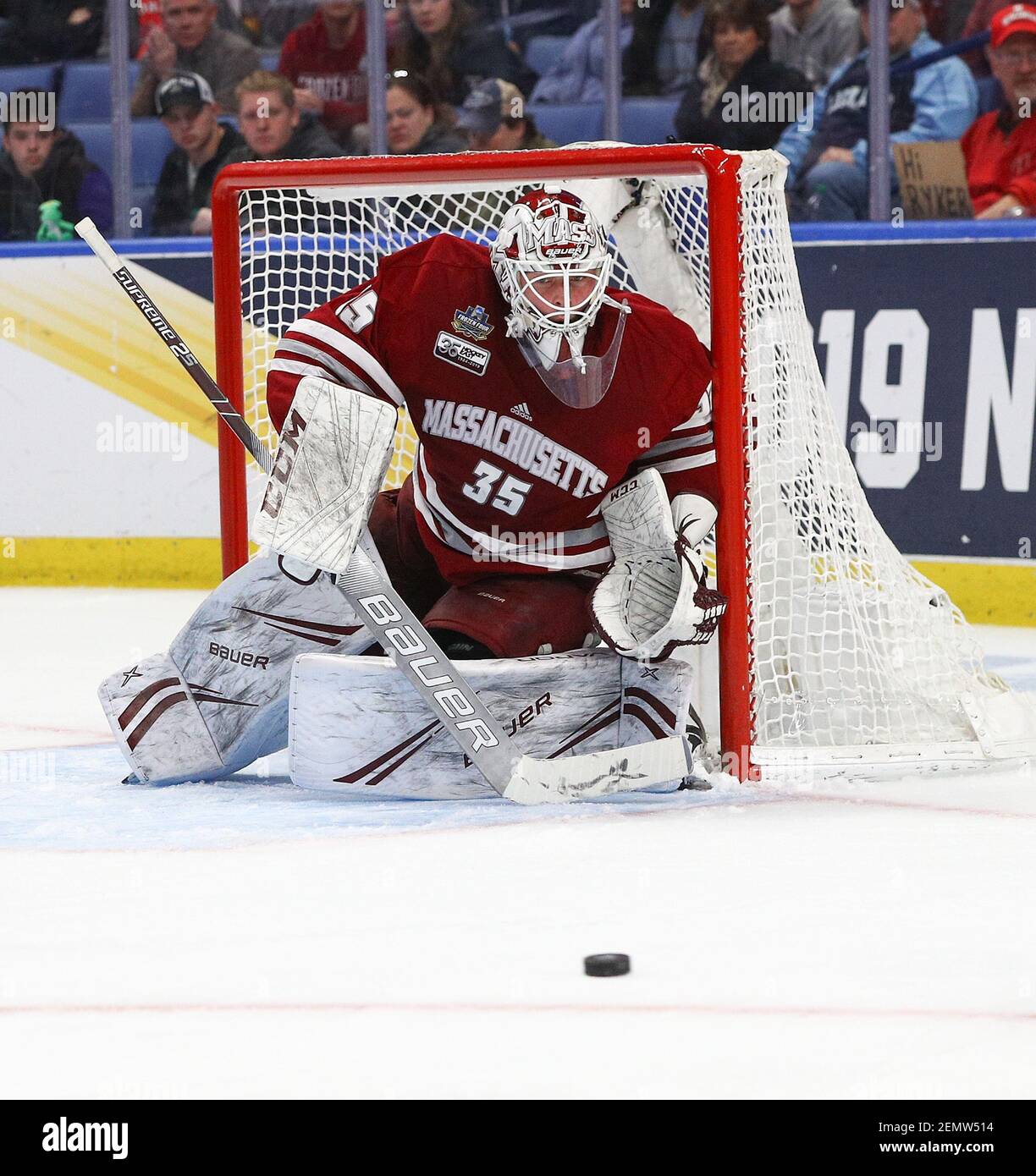 Massachusetts Minutemen goaltender Filip Lindberg (35) eyes up an