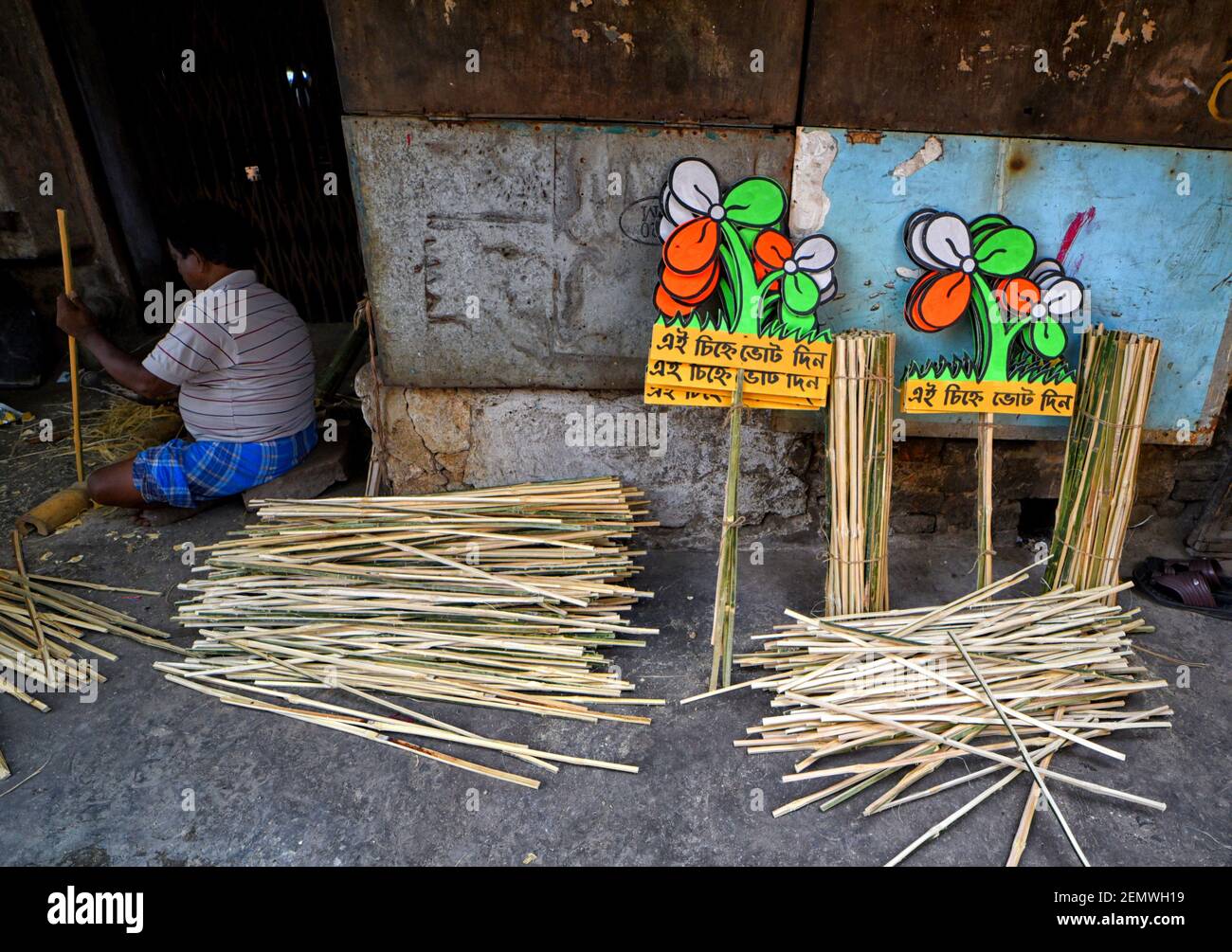 A worker seen preparing the Election Hoarding for All India Trinamool  Congress (TMC) on the street
