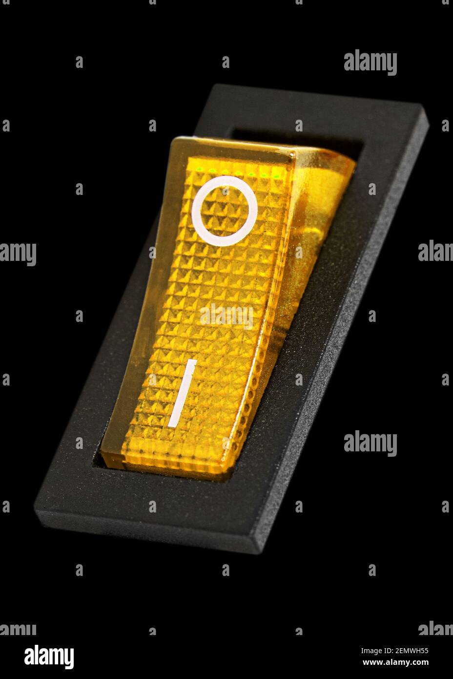 Yellow power switch at ON position, isolated on black background Stock ...