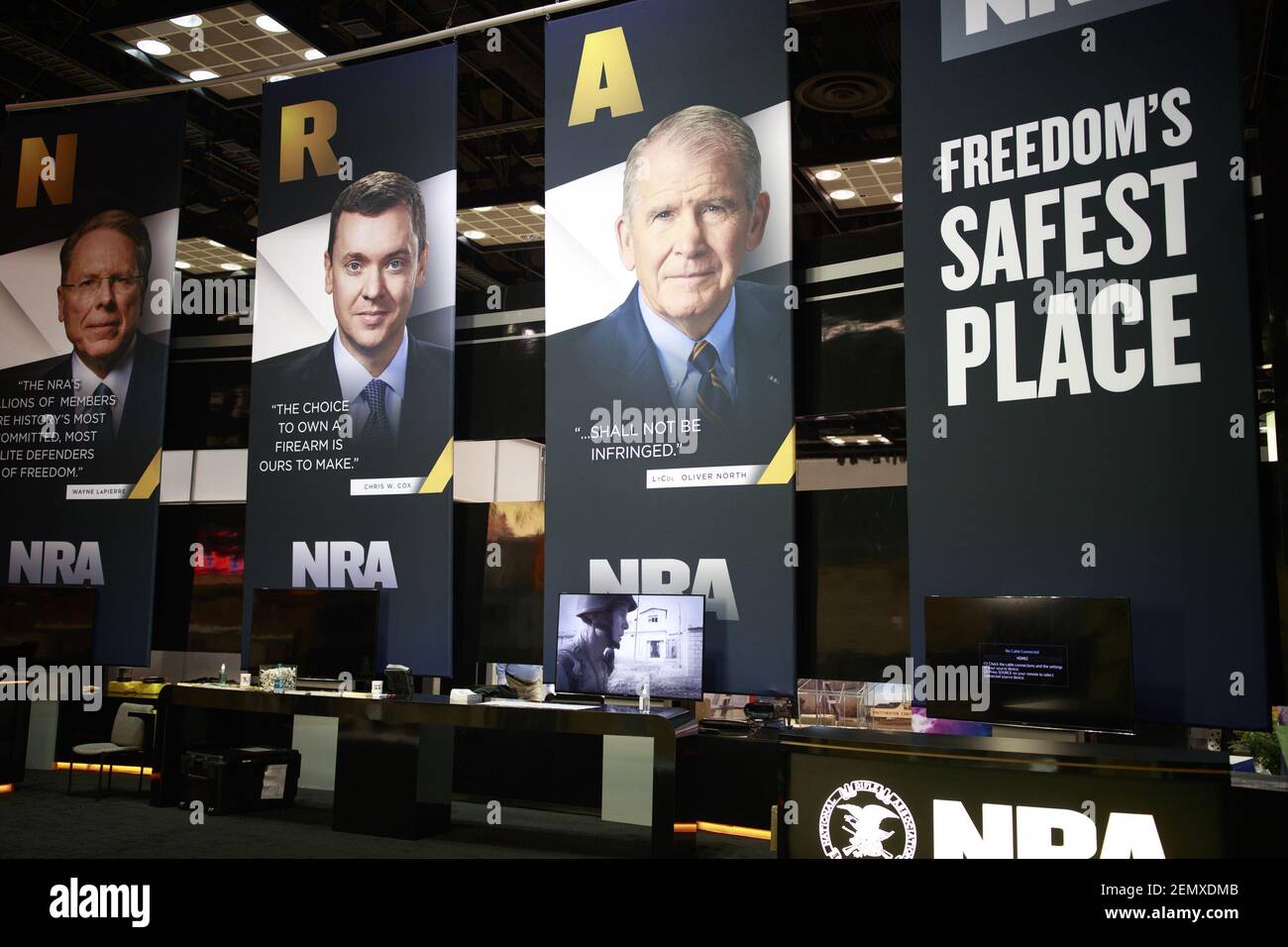 NRA executives are displayed in the exhibition hall. Vendors prepare