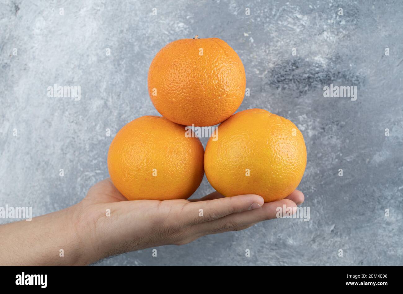 Hand holding three fresh hi-res stock photography and images - Alamy