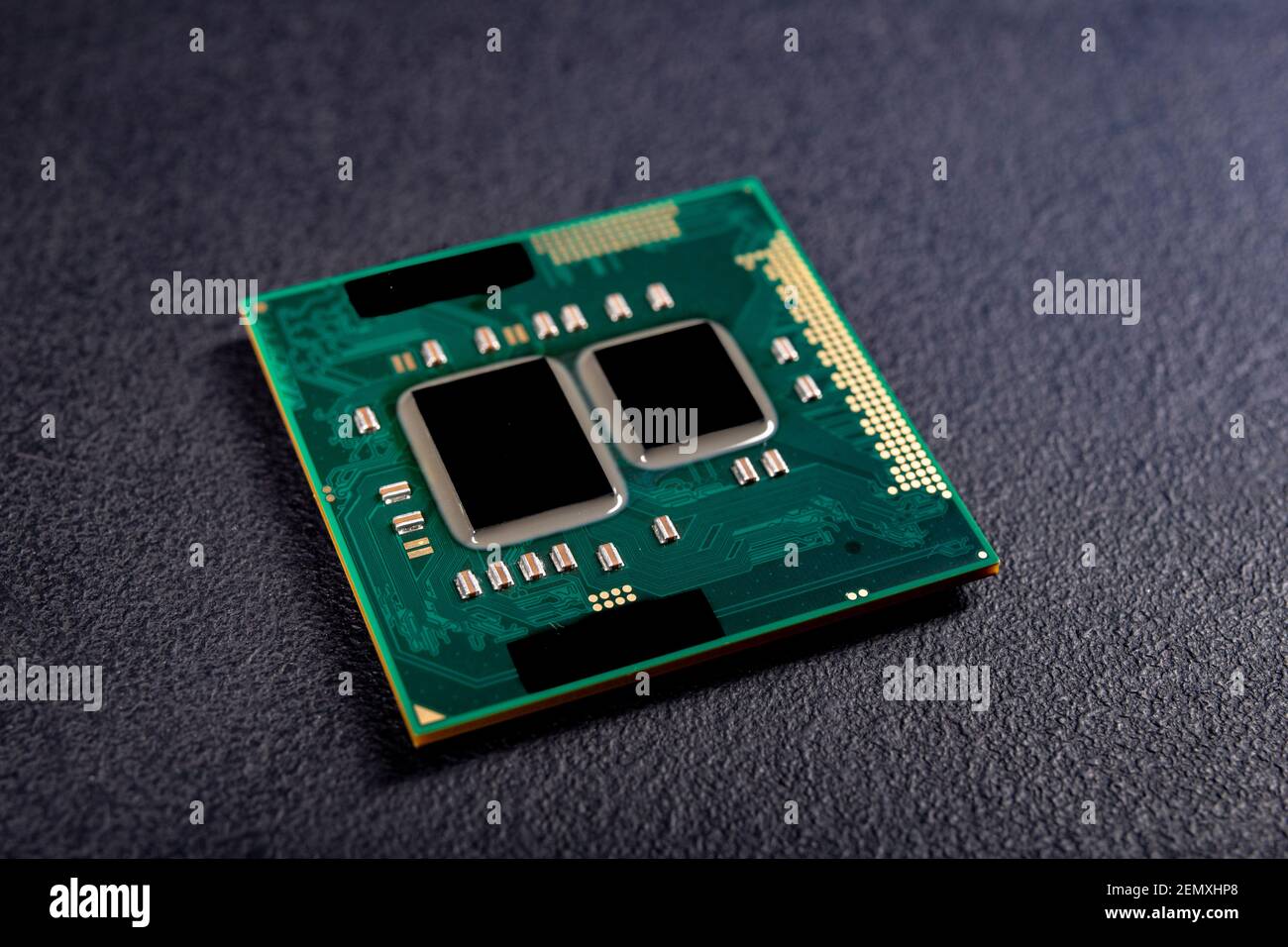 A computer processor used in notebook computers. Spare parts for the repair  of electronic devices. Dark background Stock Photo - Alamy