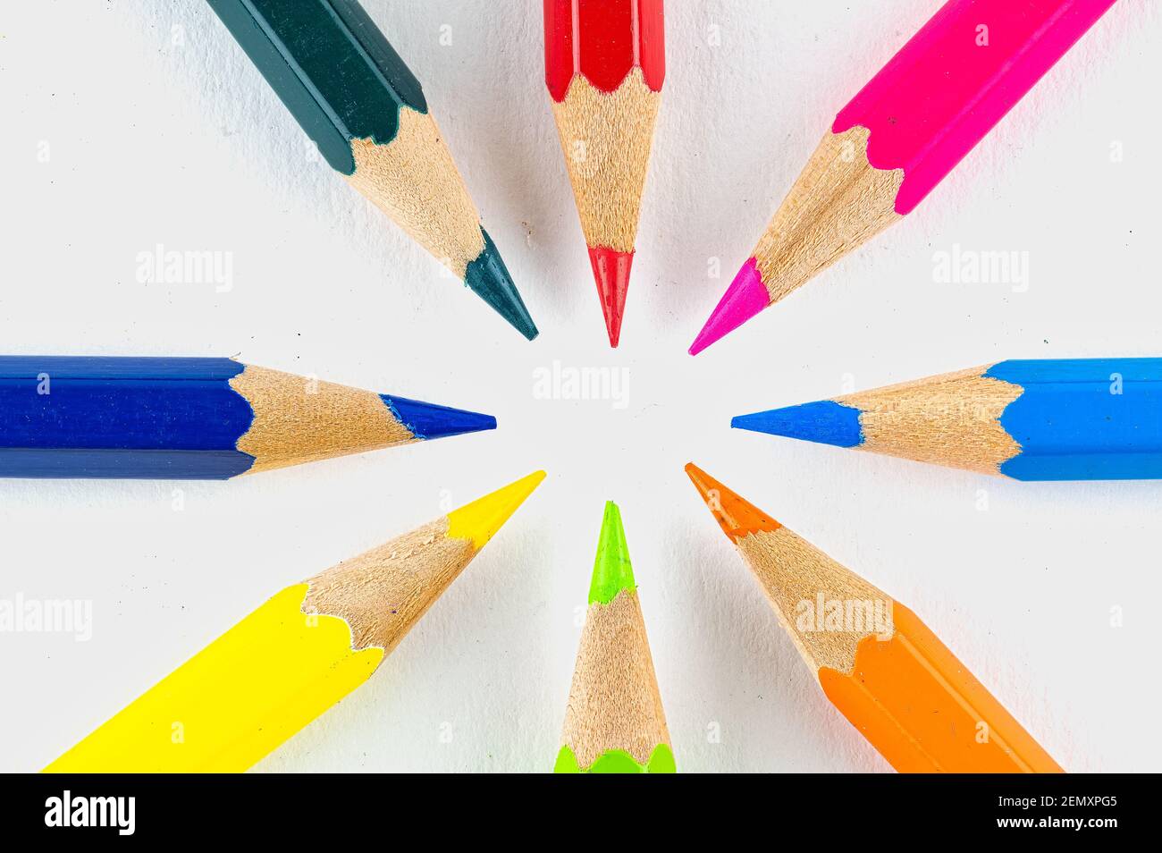Different coloured colouring pencils arranged in a circle Stock Photo