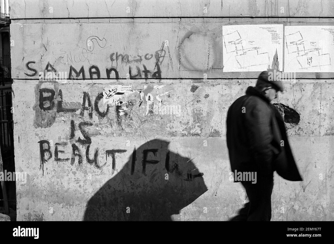 UK, West London, Notting Hill, 1973. Grafitti says 'Black is Beautiful'. The poster stuck on the wall is the route of The Notting Hill Peoples Carnival (exact year unknown) and says 'Everything is Free'. Stock Photo