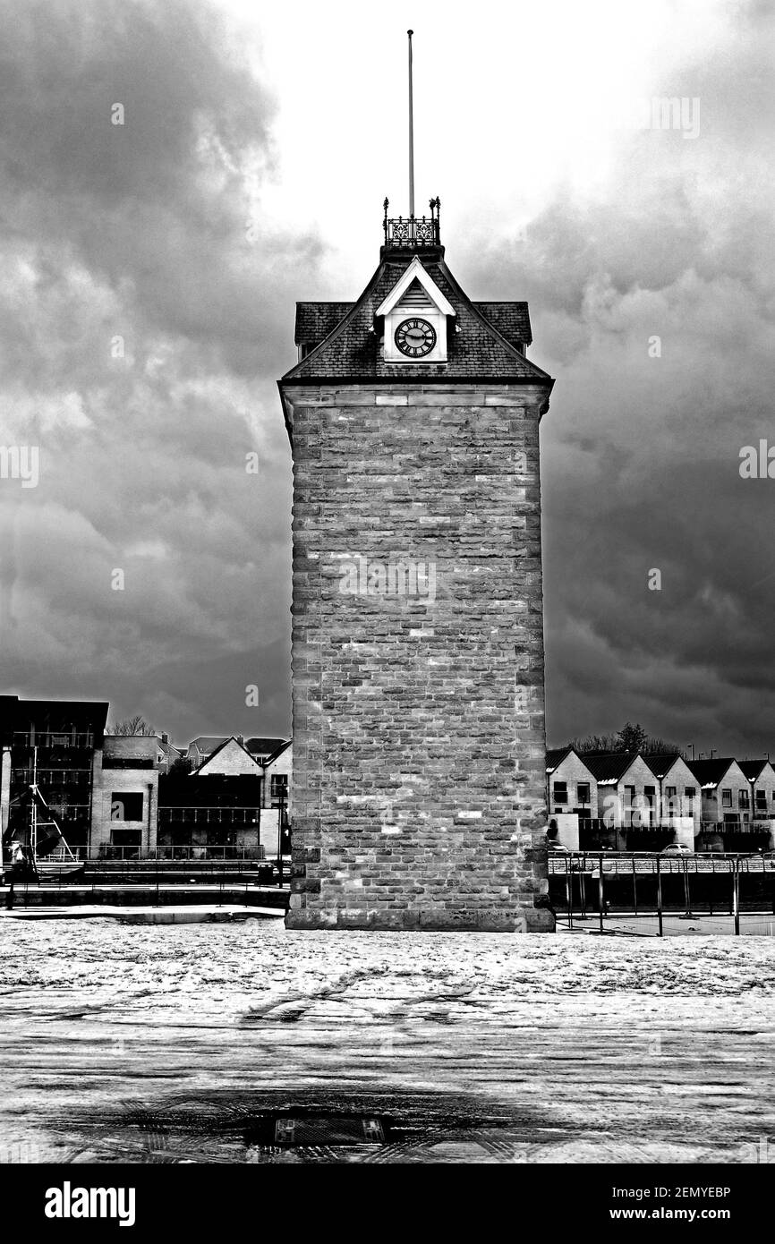 Old clocktower in North Shields Royal quays marina lock after snowfall