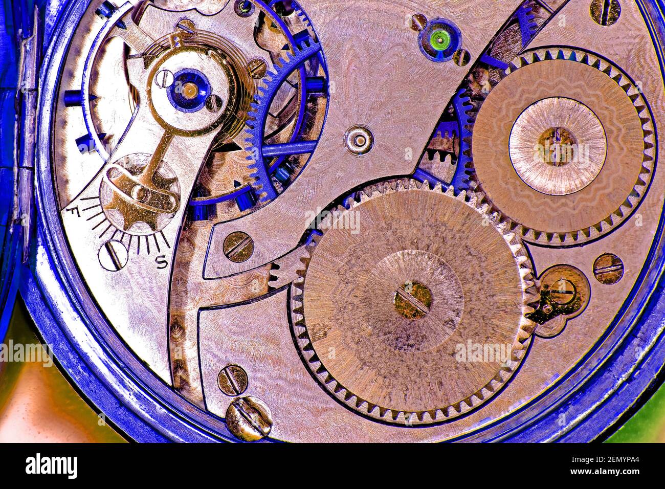 Pocket watch clockwork workings open case in blue and pink Stock Photo ...