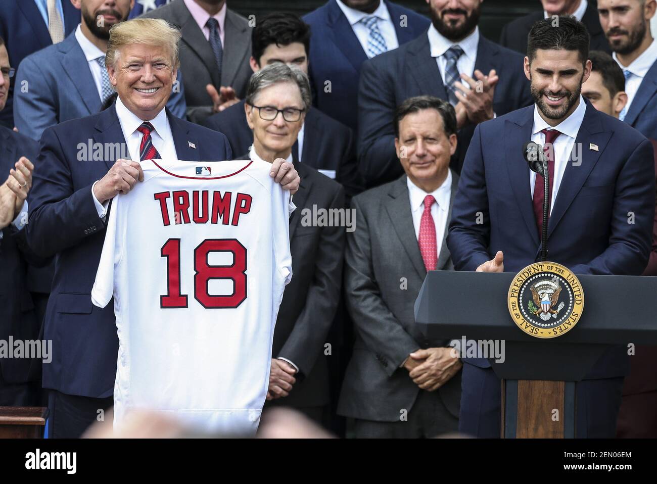 President Donald Trump receives a jersey with his name from Boston Red Sox J.D.  Martinez, Right Fielder, right, as he welcomes the 2018 World Series  Champions to the White House, The Boston