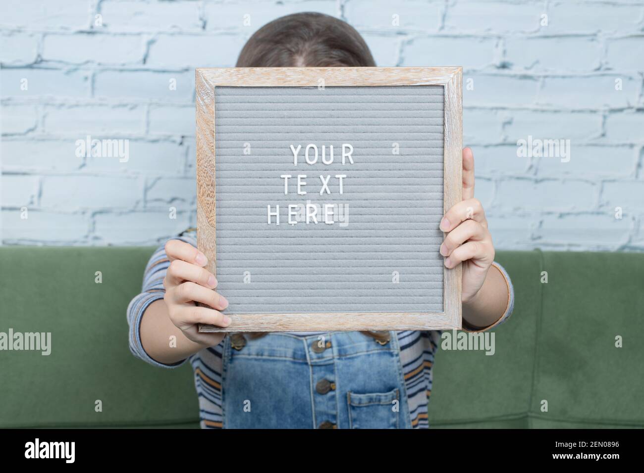Your text here poster in the hand of a person Stock Photo - Alamy