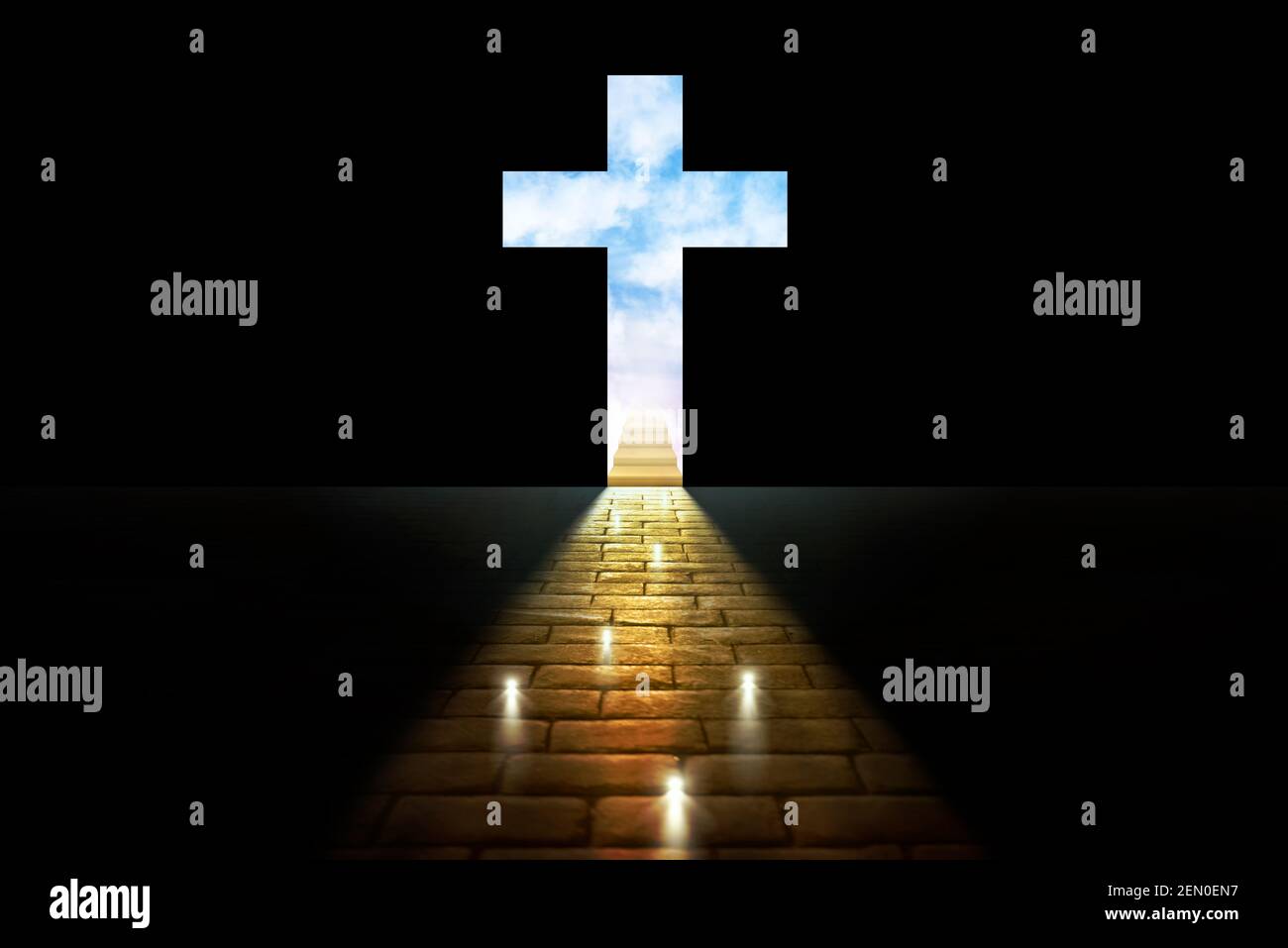 Concept of souls entering the kingdom of heaven with lights on stone pavers leading to a cross cut out on a black background with stairs and sky behin Stock Photo
