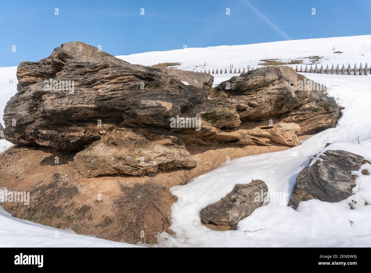 Fenced Stone Rock In The Middle Of Snowy Mountains In Winter Against A Blue Sky Stock Photo Alamy Fenced Stone Rock In The Middle Of Snowy Mountains In Winter Against A Blue Sky Stock Photo Alamy