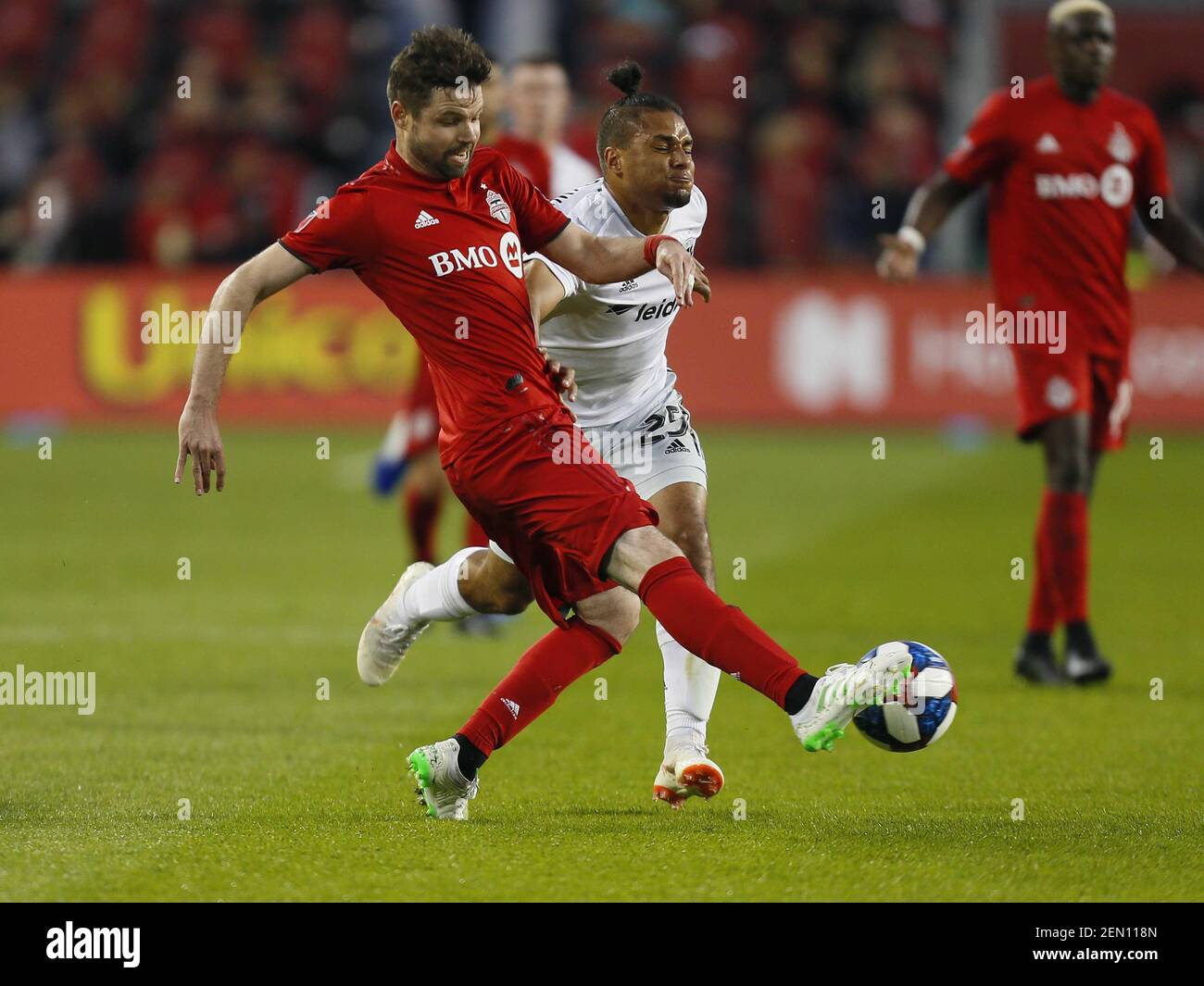 May 15 19 Toronto Ontario Can Toronto Fc Defender Drew Moor 3 Kicks The Ball As D C United Midfielder Quincy Amarikwa 25 Defends During The First Half At Bmo Field Mandatory Credit