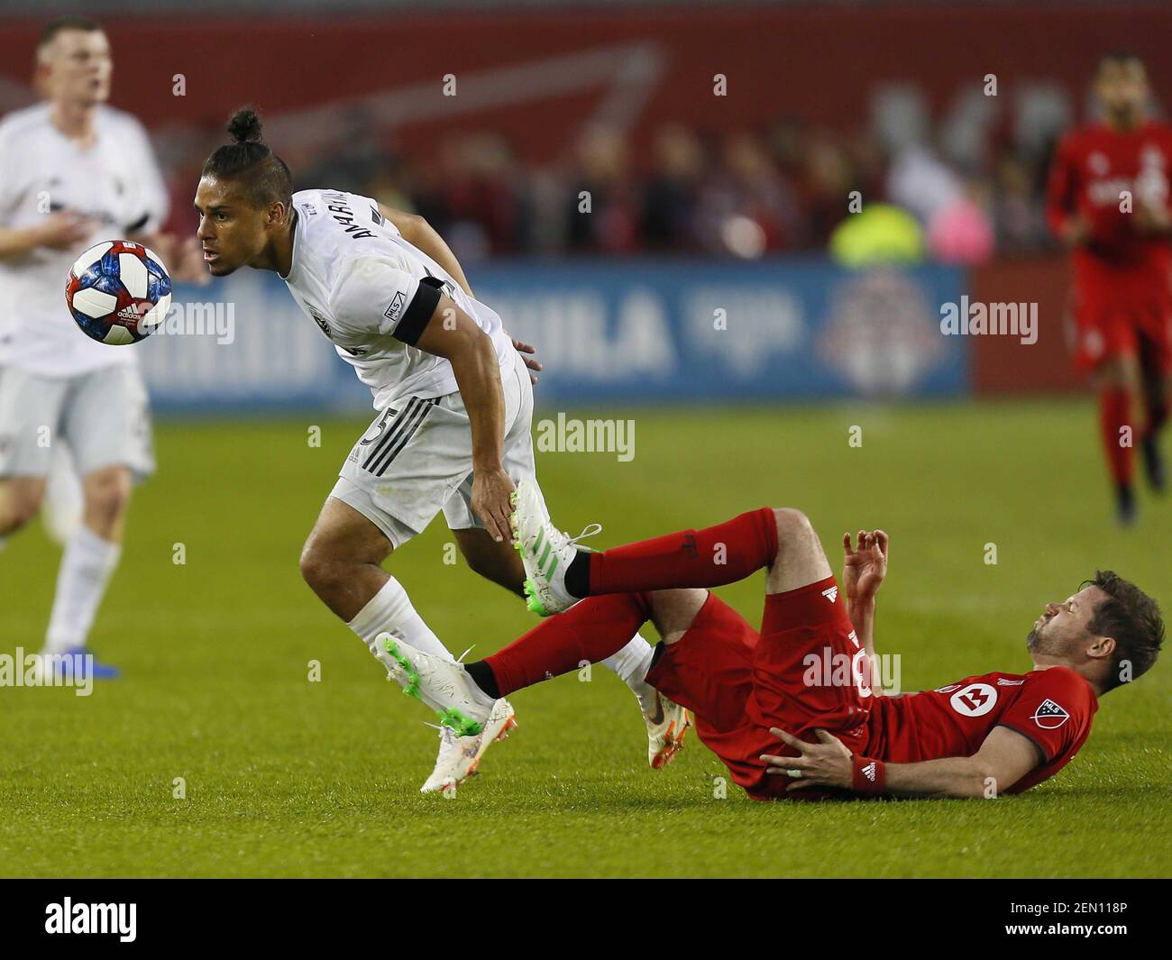 May 15 19 Toronto Ontario Can D C United Midfielder Quincy Amarikwa 25 Goes After A Loose Ball After Toronto Fc Defender Drew Moor 3 Falls During The First Half At Bmo Field