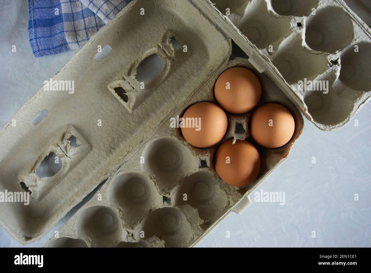Organic brown eggs in containers. Stock Photo