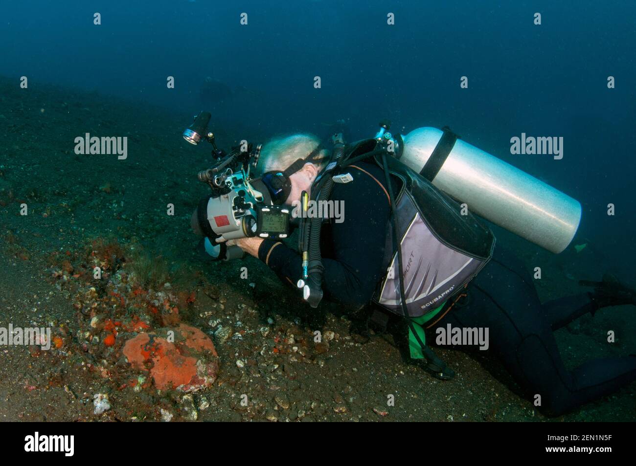 Man photographing underwater, Wreck Slope dive site, Tulamben, Karangasem, Bali, Indonesia, Indian Ocean Stock Photo