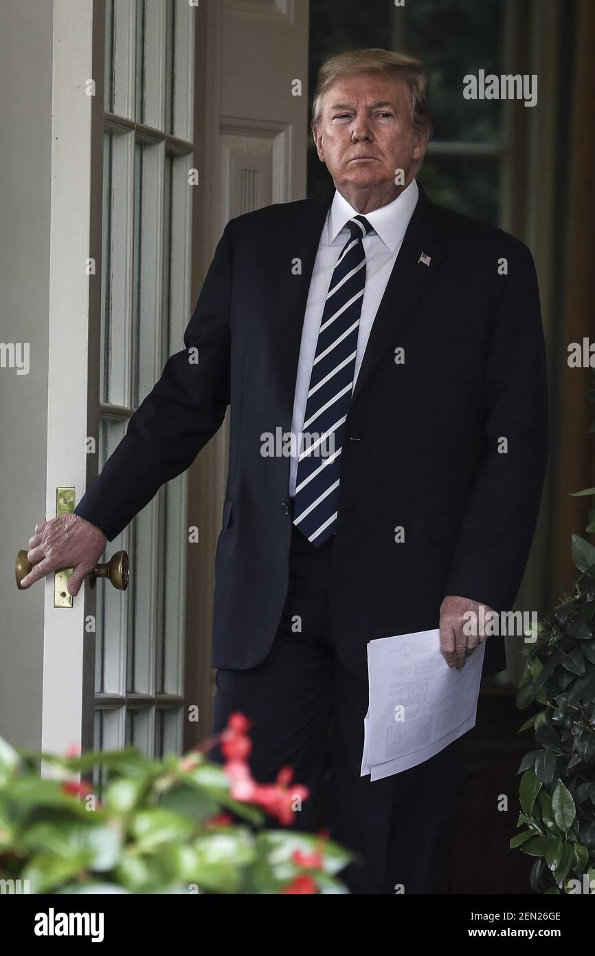 President Donald Trump walks out of the Oval Office to speaks in the ...