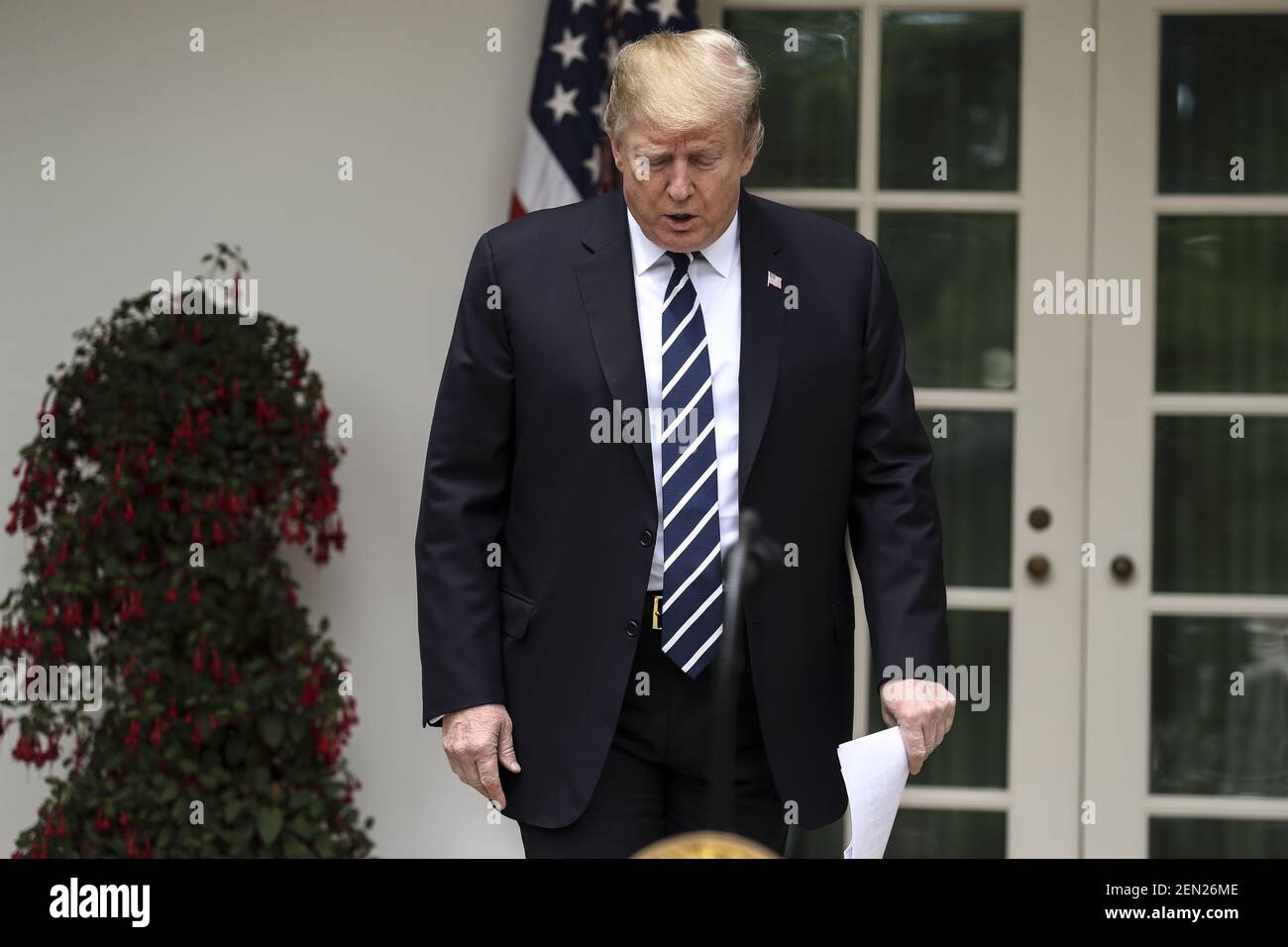 President Donald Trump walks out of the Oval Office to deliver an ...