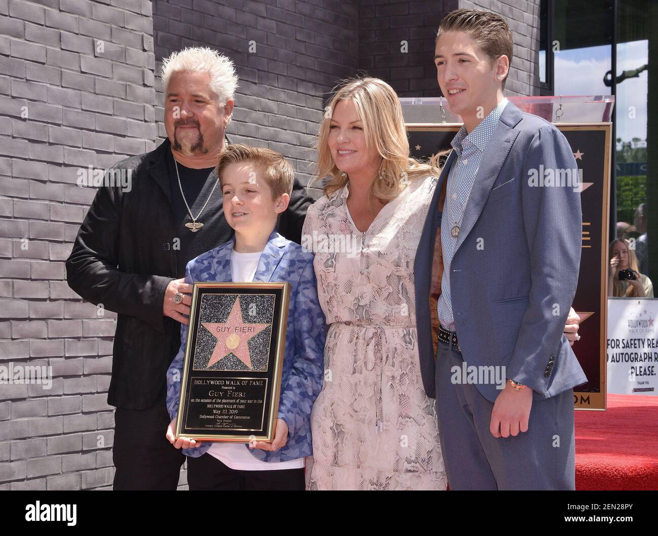 (L-R) Guy Fieri, Son Ryder Fieri, Wife Lori Fieri and Son Hunter Fieri
