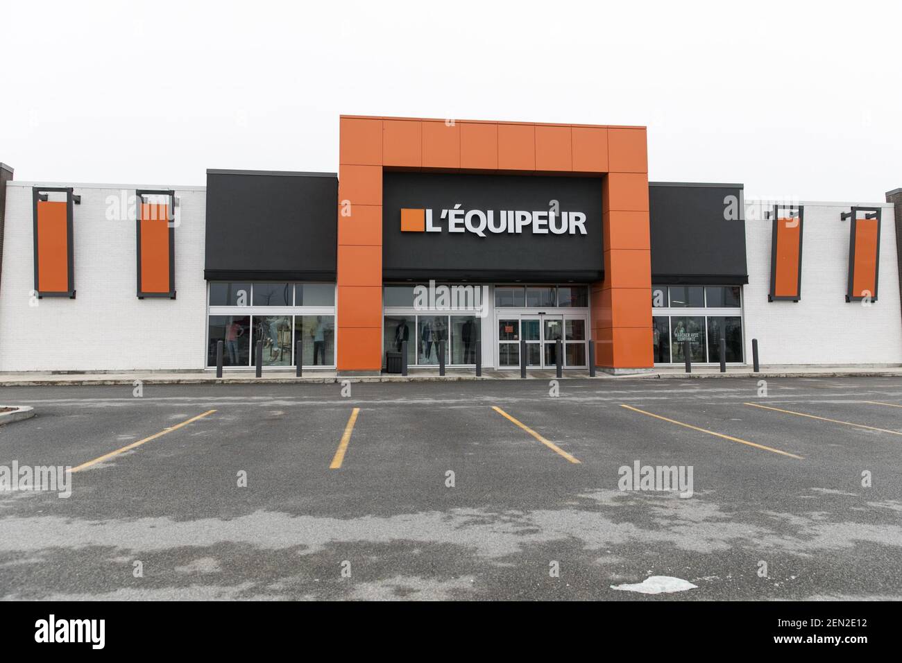 A logo sign outside of a L’Équipeur retail store location in Vaudreuil