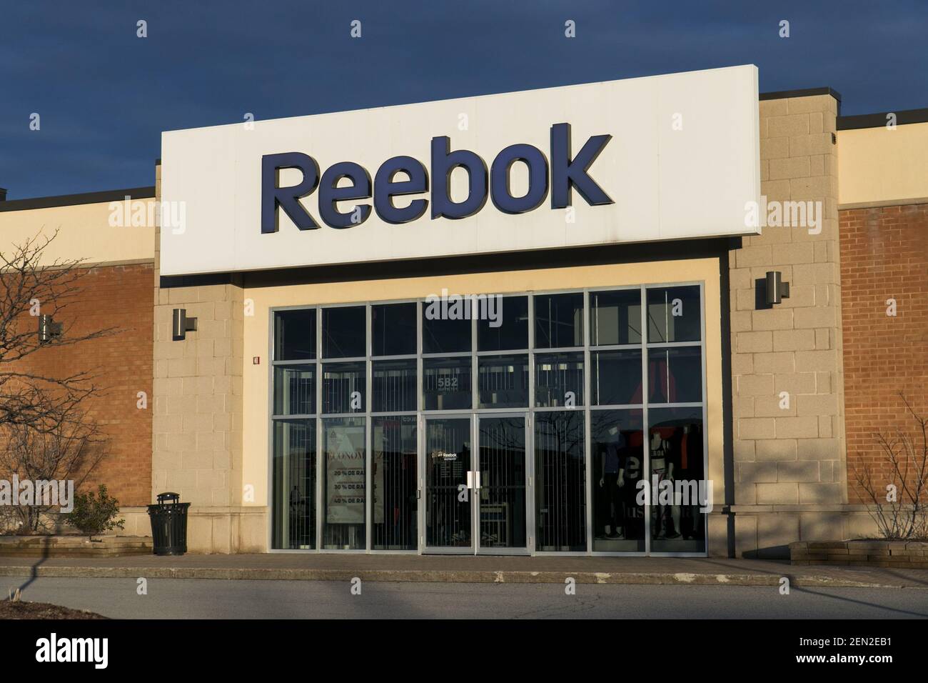 A logo sign outside of a Reebok retail store location in Boucherville,  Quebec, Canada, on April 21, 2019 Stock Photo - Alamy