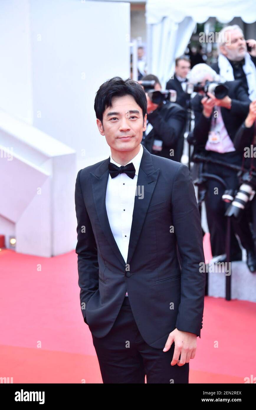 Chinese actor Li Guangjie poses on the red carpet for the closing ...