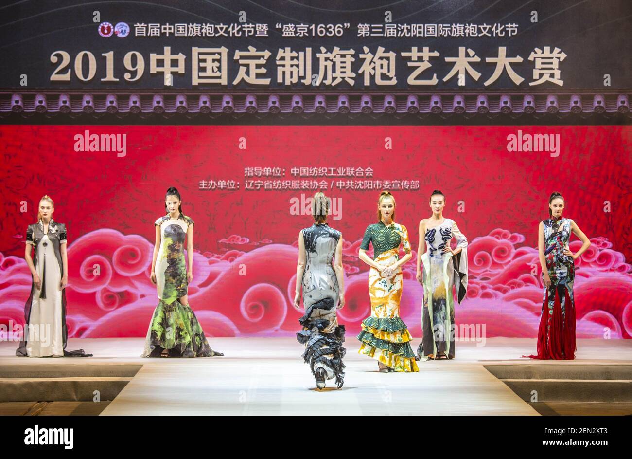 A model dressed in Cheongsam a traditional Chinese dresses also known as Qipao poses during the 2019 China Tailored Cheongsam Art Show in Shenyang city northeast China s Liaoning province 25 May 2019