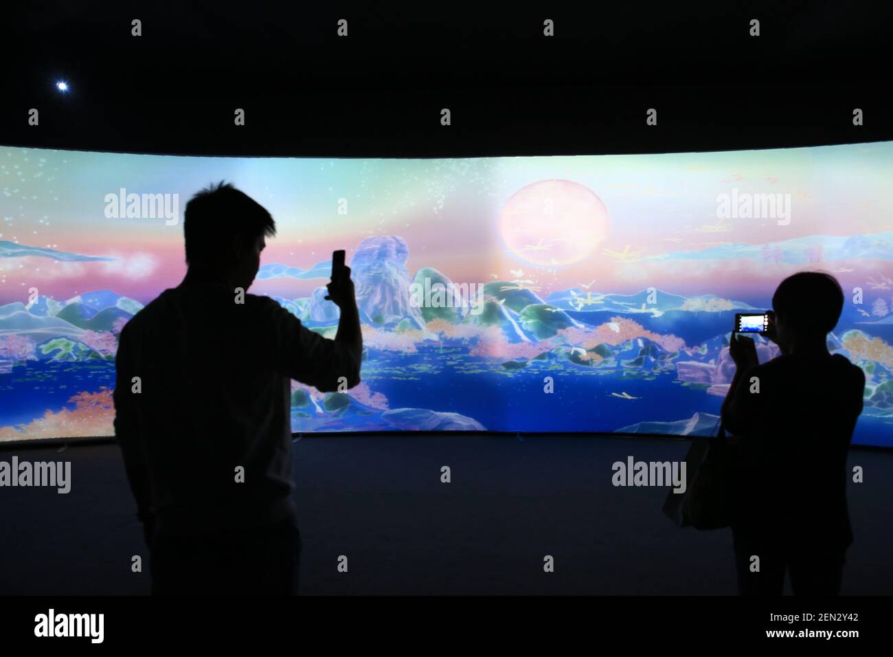 Visitors view an immersive digital art exhibition themed around big ...