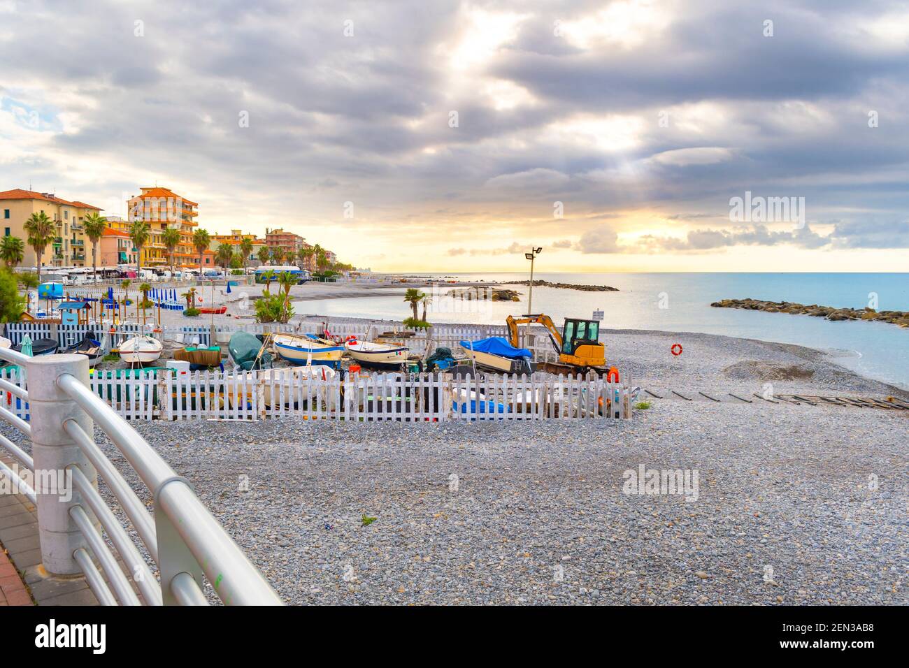 Morning sunlight along the Mediterranean Sea at the coastal resort town of Ventimiglia, Italy, on the Italian Riviera. Stock Photo