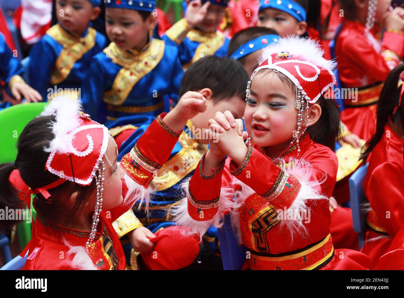 Huaying, CHINAKids wearing traditional Chinese clothes hanfu