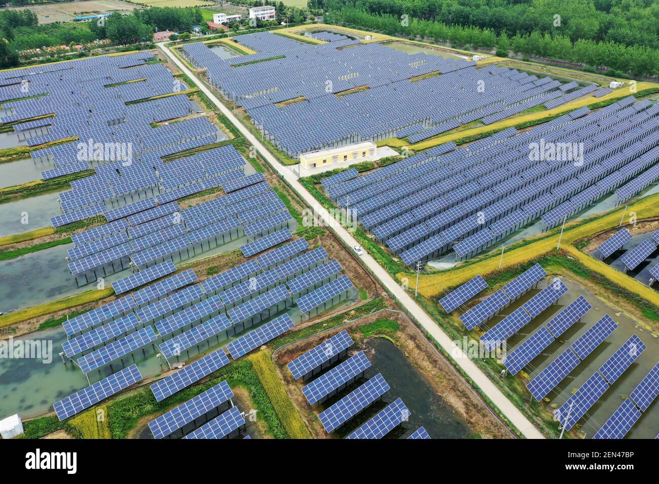 FILE--Aerial view of a floating solar energy farm at a photovoltaic power  station in Hongze district, Huai'an city, east China's Jiangsu province, 18  May 2019. Located in the east coast of mainland