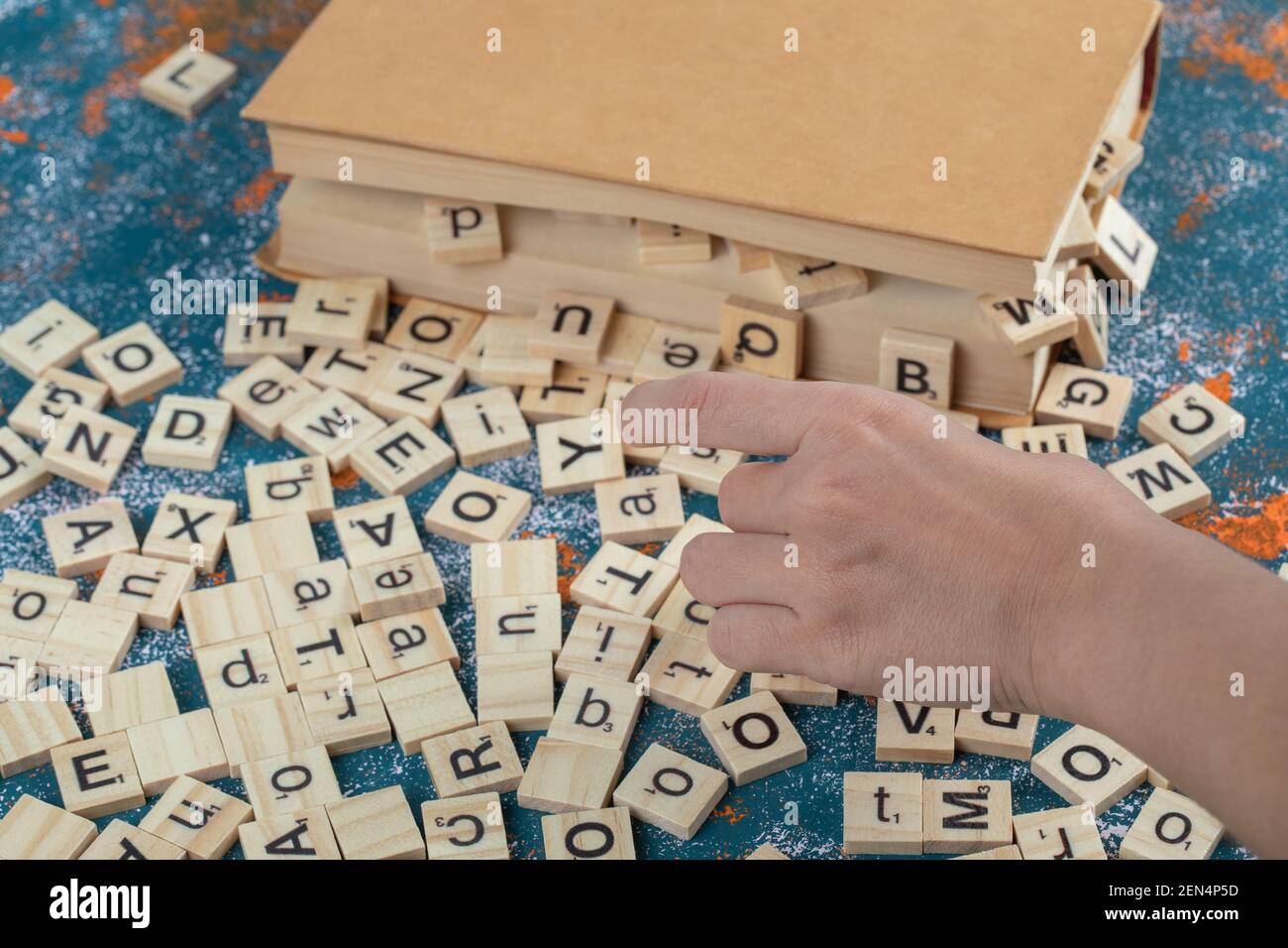 Wooden Letter Dice Over The Pages Of A Book Stock Photo Alamy
