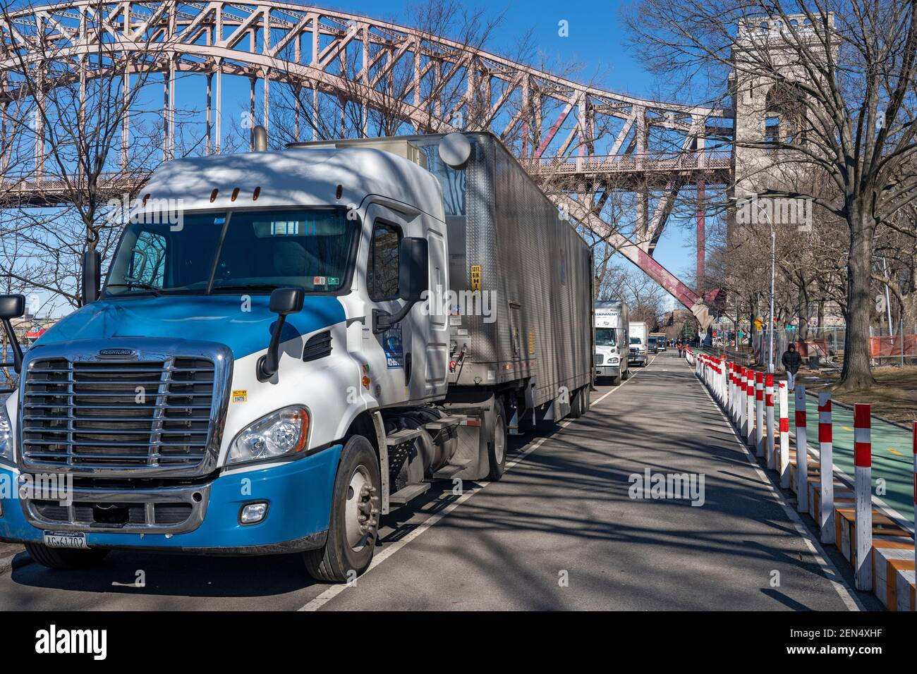 NEW YORK, NY – FEBRUARY 25: Film production trucks are parked in Astoria Park in preparation for the filming of the television show 'Blue Bloods' season eleven on February 25, 2021 in New York City. Credit: Ron Adar/Alamy Live News Stock Photo