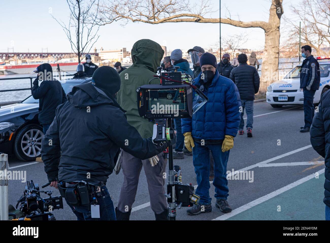NEW YORK, NY – FEBRUARY 25: Crew and stand-ins rehearse for the filming of the television show 'Blue Bloods' season eleven in Astoria Park on February 25, 2021 in New York City. Credit: Ron Adar/Alamy Live News Stock Photo