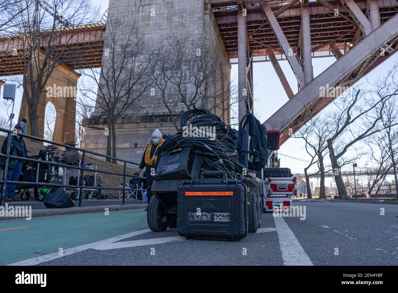 NEW YORK, NY – FEBRUARY 25: Crew and electric equipment seen during the filming of the television show 'Blue Bloods' season eleven in Astoria Park on February 25, 2021 in New York City. Credit: Ron Adar/Alamy Live News Stock Photo