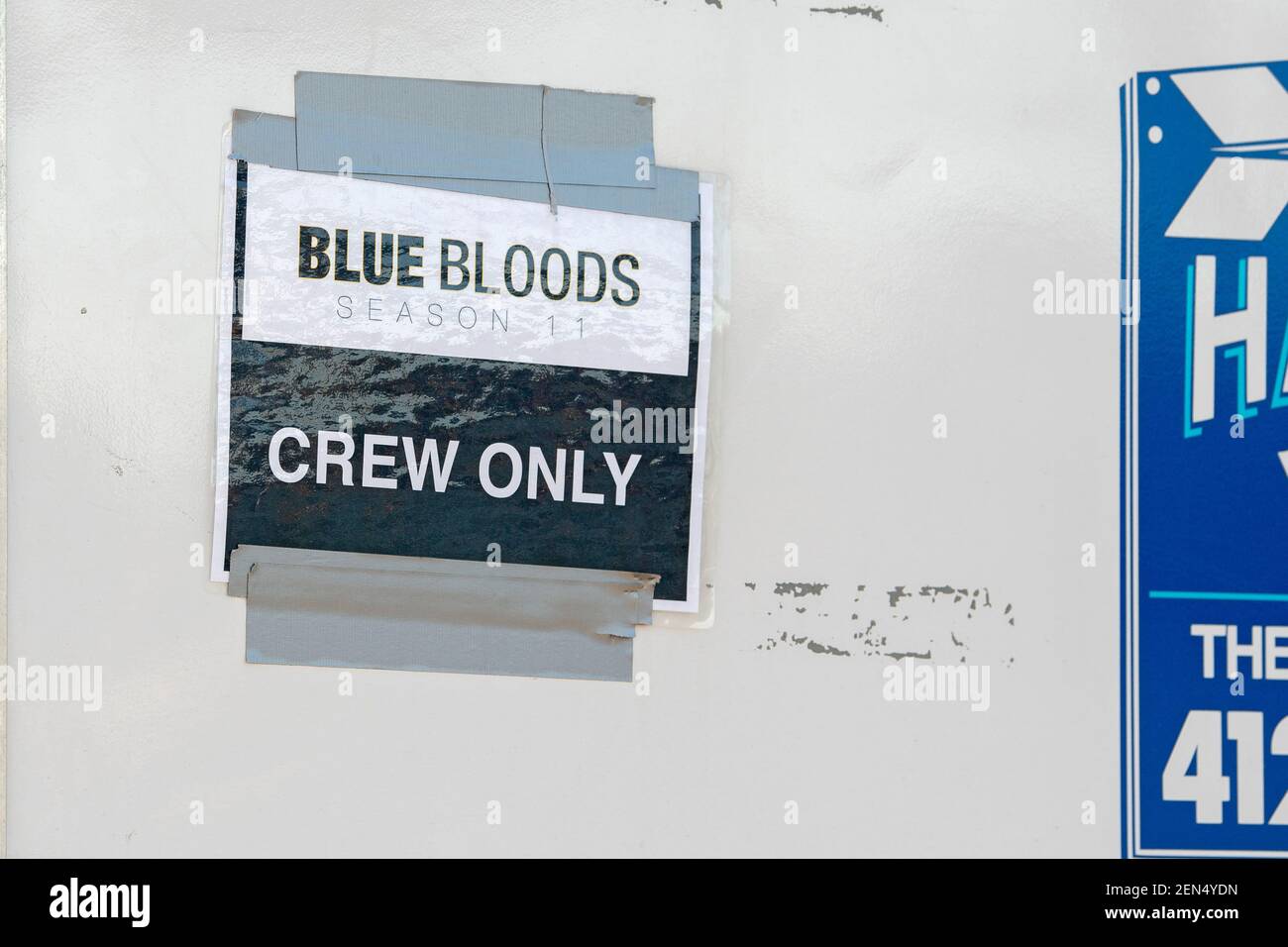 NEW YORK, NY – FEBRUARY 25: Sign reading 'Blue Bloods Season Eleven Crew Only' seen on a film production trailer during the filming of the television show 'Blue Bloods' season eleven in Astoria Park on February 25, 2021 in New York City. Credit: Ron Adar/Alamy Live News Stock Photo