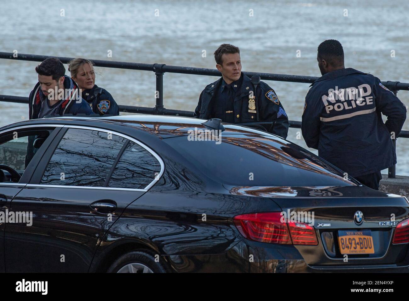 NEW YORK, NY – FEBRUARY 25: Vanessa Ray (CL) and Will Estes (CR) are seen during the filming of the television show 'Blue Bloods' season eleven in Astoria Park on February 25, 2021 in New York City. Credit: Ron Adar/Alamy Live News Stock Photo