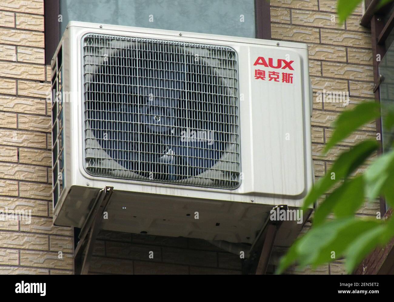 An air conditioner of AUX is installed at a residential building in Yichang  city, central China's Hubei province, 11 June 2019. China's top market  regulator is paying high attention to air-conditioner manufacturer