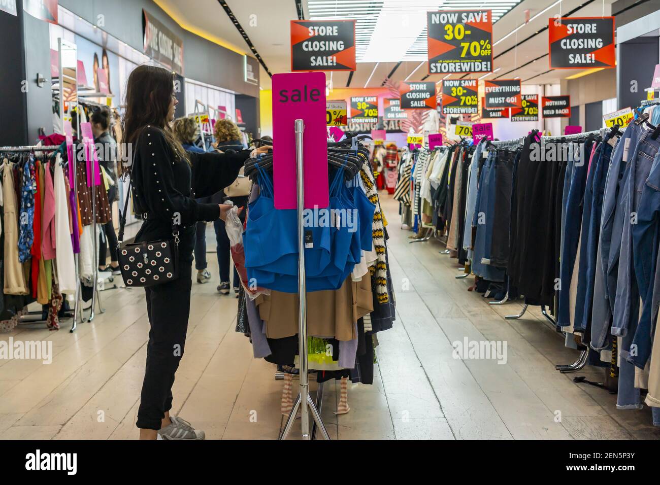 Shoppers browse the sales at the TopShop/TopMan store on Fifth Avenue in  New York on Thursday, June 13, 2019. The Arcadia Group, the owner of the  TopShop chain, announced that it will