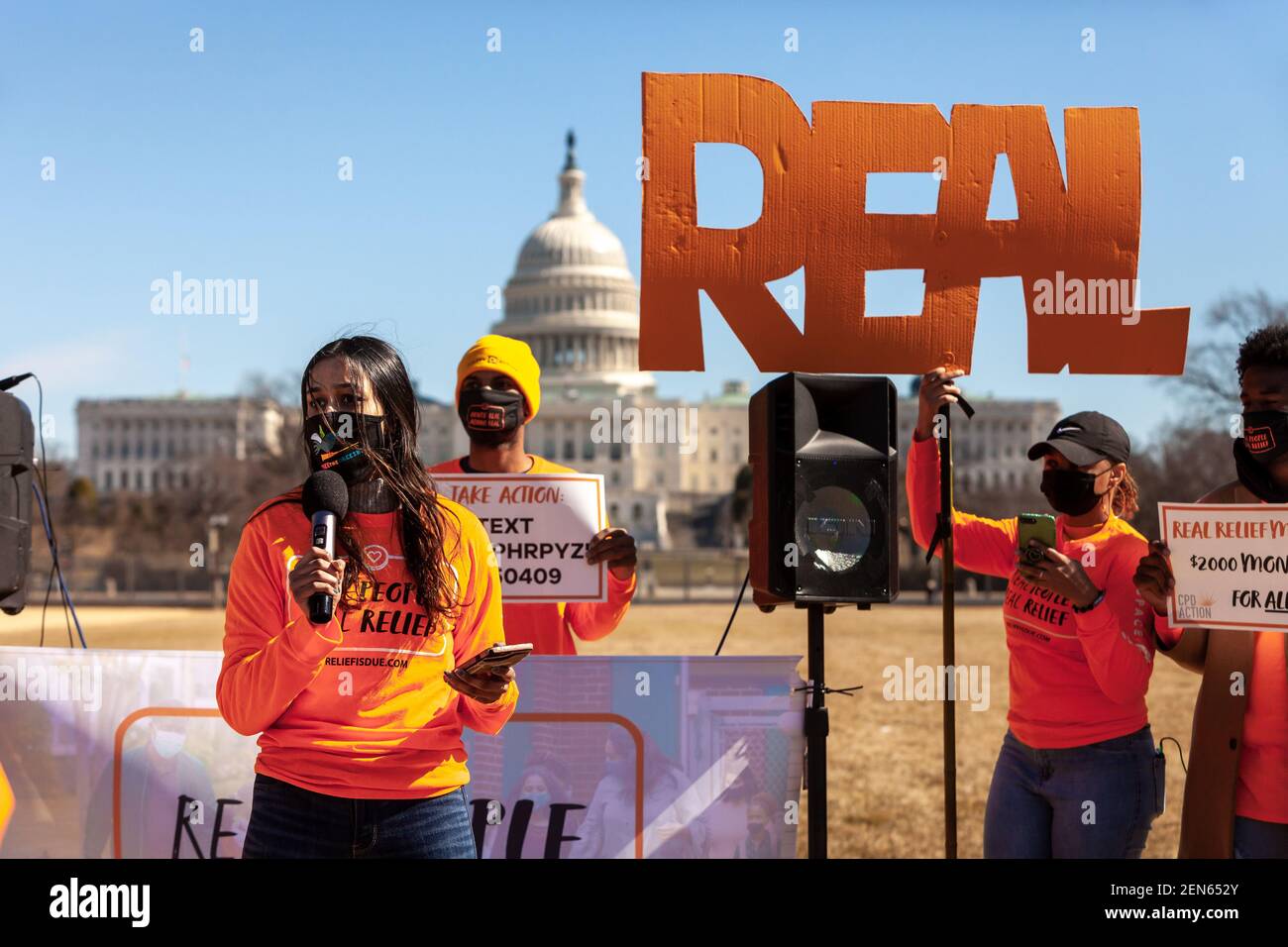 Washington, DC, USA, 25 February, 2021.  Pictured: Protesters called for Congress to make regular payments to everyone in the US and create a path to citizenship for undocumented residents.  Credit: Allison C Bailey/Alamy Live News Stock Photo