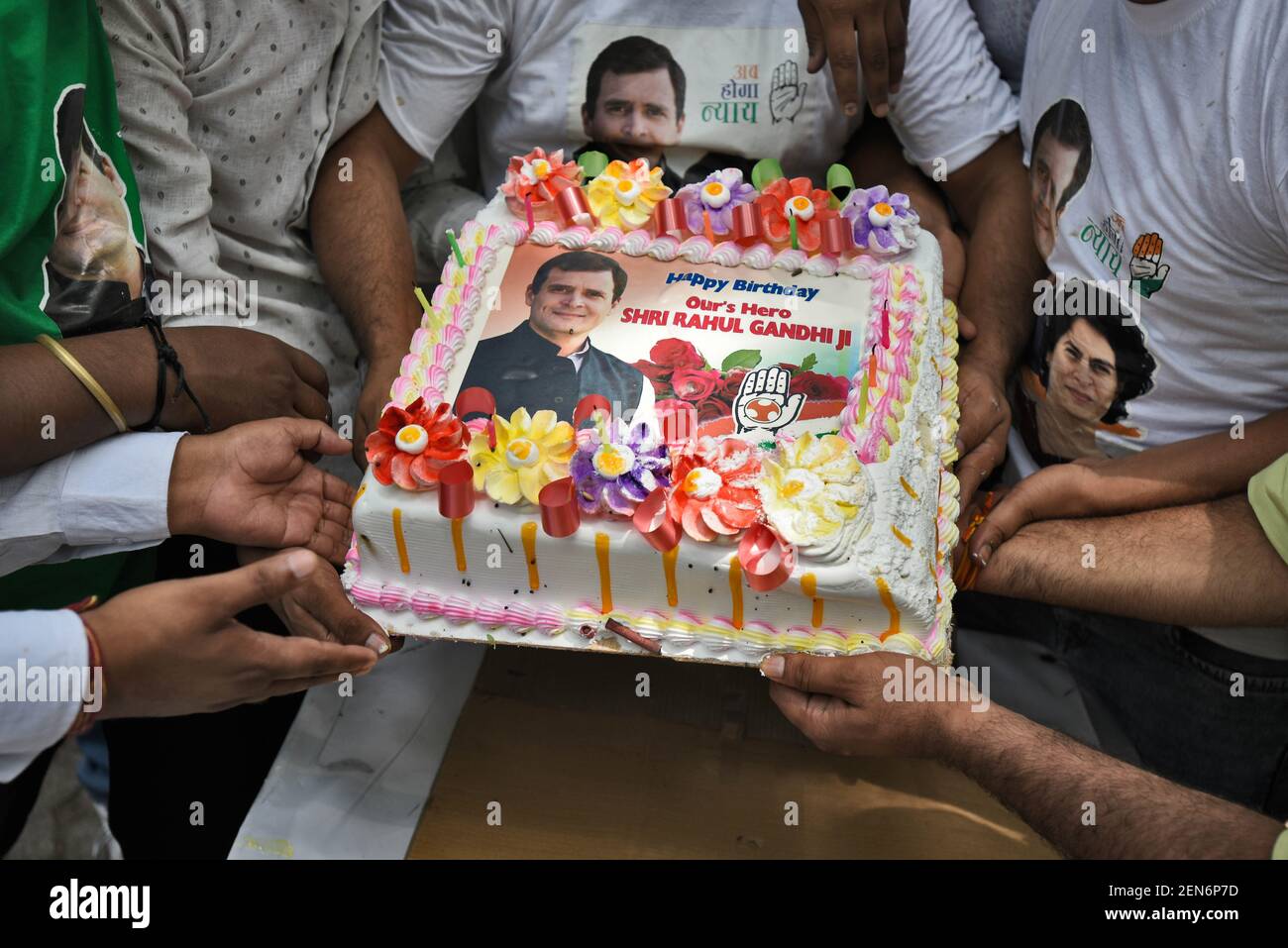 NEW DELHI, INDIA - JUNE 19: Congress party supporters hold a cake ...