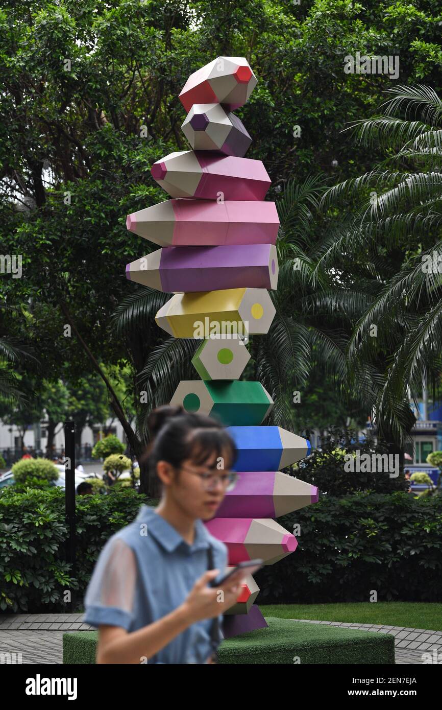 A colored pencil installation is on display at a square amongst office  buildings in Guangzhou city, south China's Guangdong province, 23 June  2019. A square amongst a cluster of high-rise office buildings