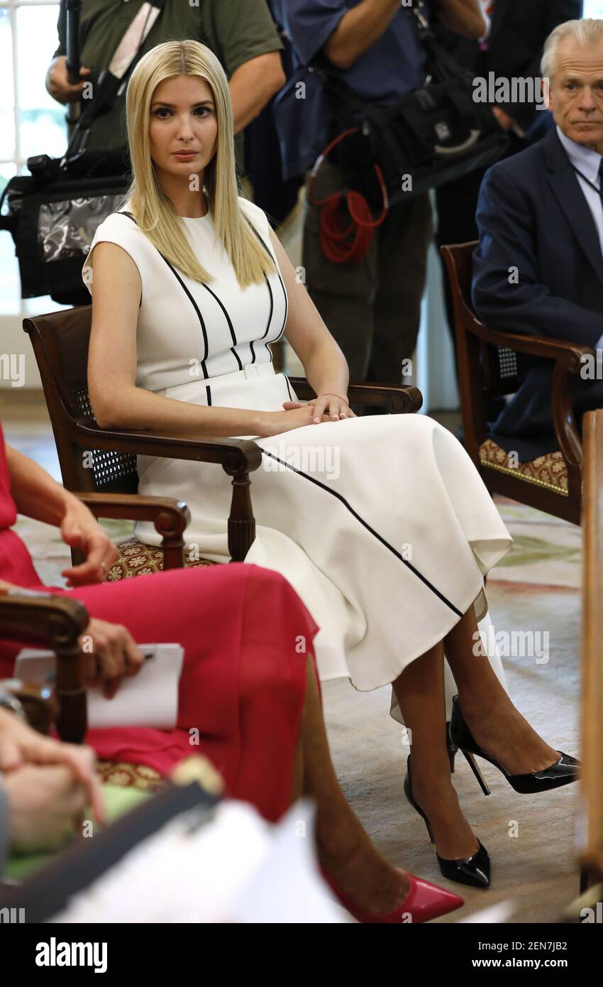 White House senior advisor Ivanka Trump (C) attends a meeting with US