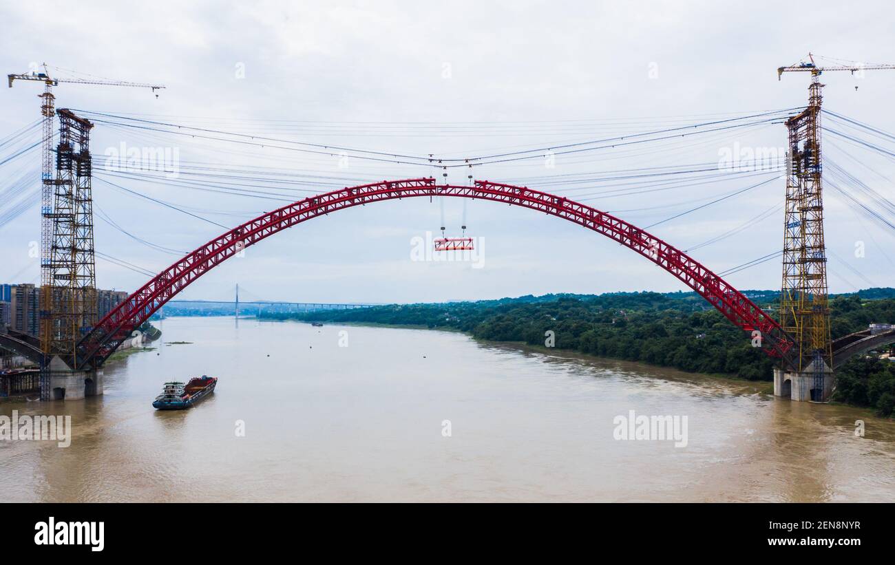 In this aerial view, the closure of main arch of Hejiang Yangtze River Bridge is completed over the Yangtze River in Hejiang county, Luzhou city, southwest China's Sichuan province, 3 July 2019. The Hejiang Yangtze River Bridge was a new arch bridge that was under construction. The construction started in January 2016 and will be built in 3 years. The main span is 507 meters. (Photo by Yi fang - Imaginechina/Sipa USA) Stock Photo
