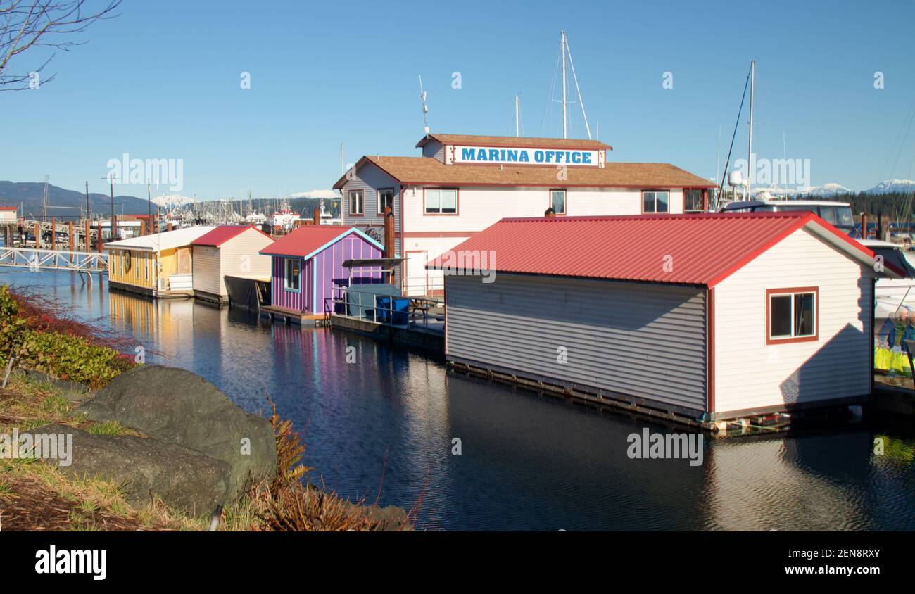 Floating offices at dock in Campbell River, BC, Canada.  Colorful buildings, sunny day, unique architecture. Stock Photo