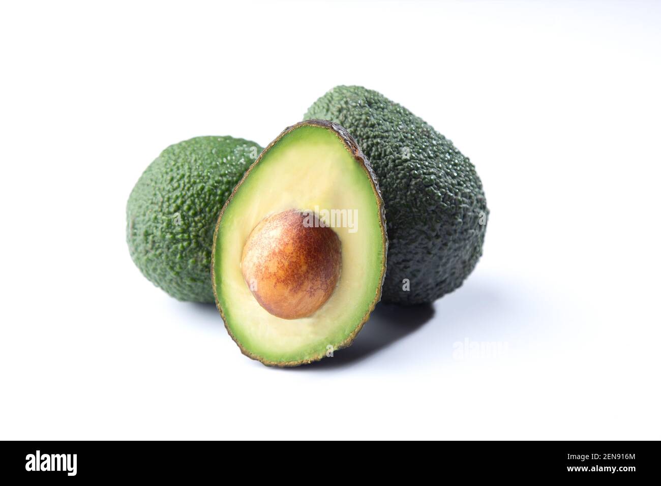 Fresh avocados isolated on white background. Stock Photo