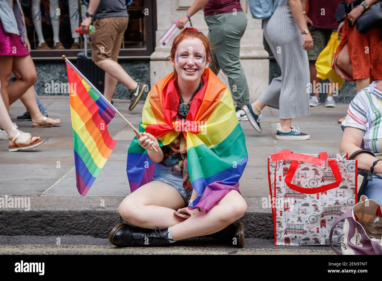 Girl wrapped in a rainbow flag during the parade. The Pride in London ...
