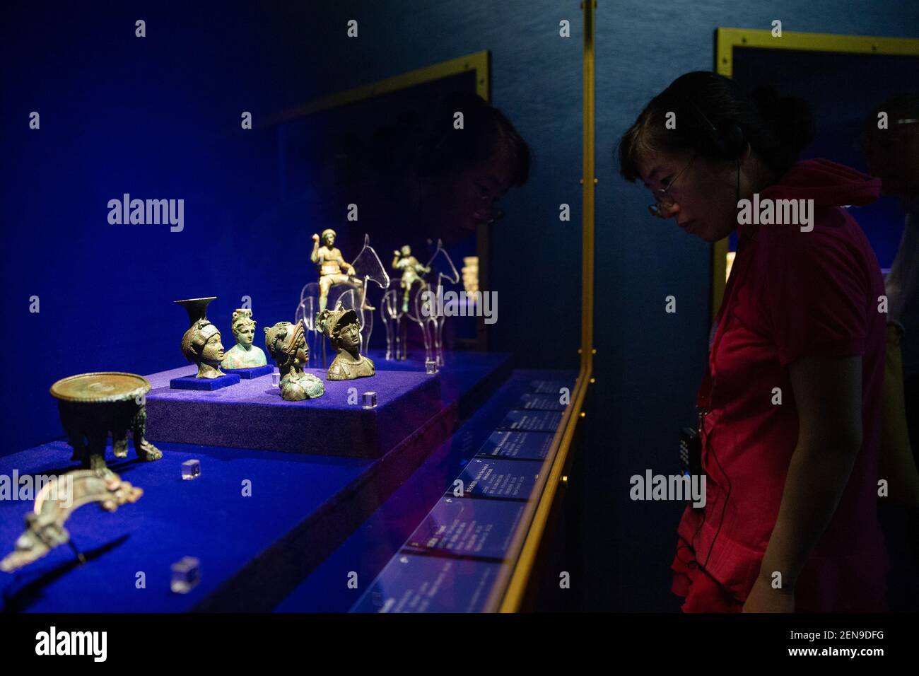 A visitor views treasures and relics from Afghan national treasures during an exhibition at a museum in Nanjing city, east China's Jiangsu province, 8 July 2019. An exhibition displayed a total of 231 pieces of the national treasures and relics from Afghan national treasures. China is holding a rich variety of exhibitions and activities on the culture of Asian countries and regions as well as exchanges among them. (Photo by Su yang - Imaginechina/Sipa USA) Stock Photo