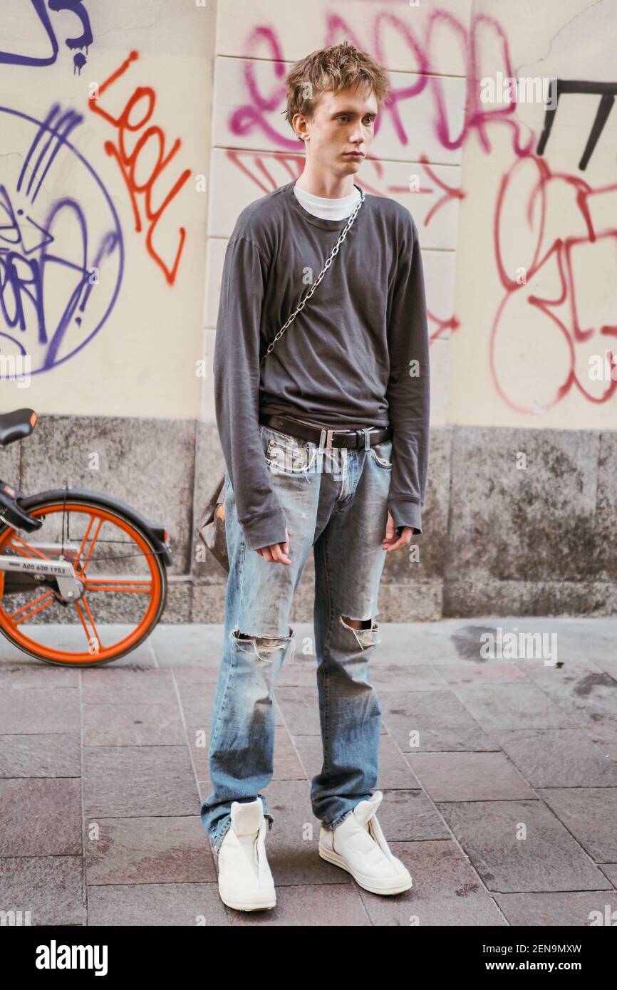 Trendy women and men pose for street 
