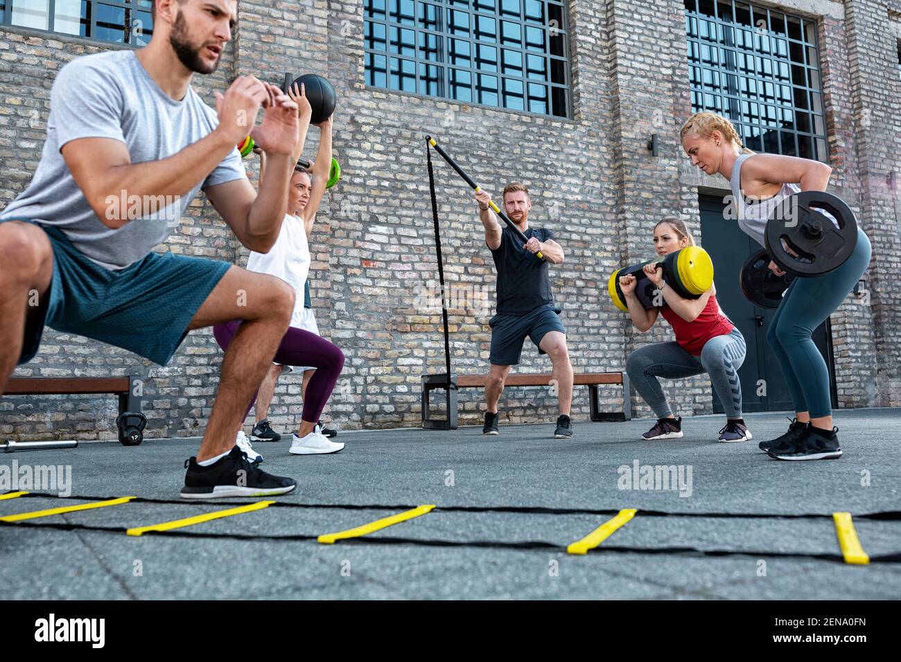 Agility ladder workout and weight lifting performed by various athletes